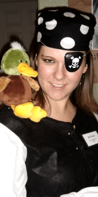 A woman dressed as a pirate playing A Dead Man's Chest, a murder mystery game