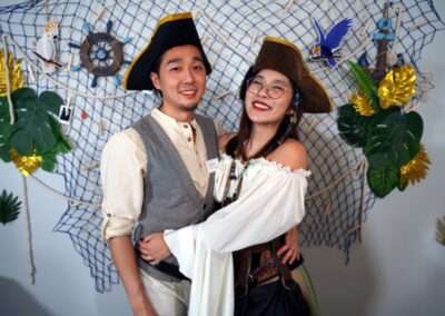 A couple in pirate costume for Davy Jones' Locker murder mystery game