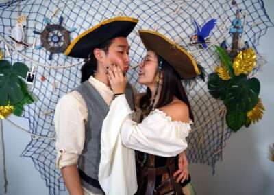 A couple in pirate costume for Davy Jones' Locker murder mystery game