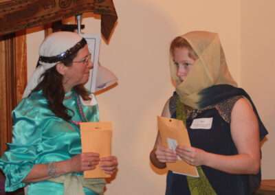 People in costume playing Arabian Nights murder mystery game.